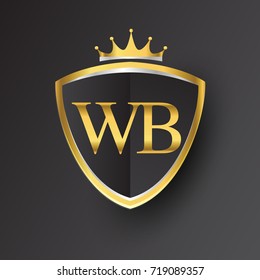 Initial logo letter WB with shield and crown Icon golden color isolated on black background, logotype design for company identity.