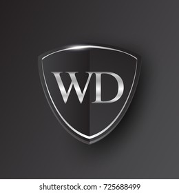 Initial logo letter WD with shield Icon silver color isolated on black background, logotype design for company identity.