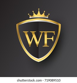 Initial logo letter WF with shield and crown Icon golden color isolated on black background, logotype design for company identity.