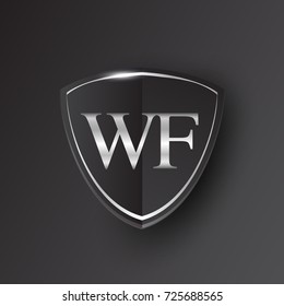 Initial logo letter WF with shield Icon silver color isolated on black background, logotype design for company identity.