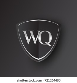 Initial logo letter WQ with shield Icon silver color isolated on black background, logotype design for company identity.