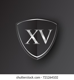 Initial logo letter XV with shield Icon silver color isolated on black background, logotype design for company identity.