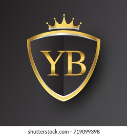Initial logo letter YB with shield and crown Icon golden color isolated on black background, logotype design for company identity.