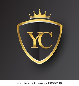 Initial logo letter YC with shield and crown Icon golden color isolated on black background, logotype design for company identity.