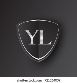 Initial logo letter YL with shield Icon silver color isolated on black background, logotype design for company identity.