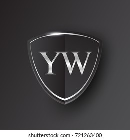 Initial logo letter YW with shield Icon silver color isolated on black background, logotype design for company identity.