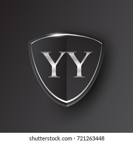 Initial logo letter YY with shield Icon silver color isolated on black background, logotype design for company identity.