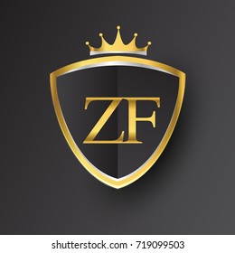 Initial logo letter ZF with shield and crown Icon golden color isolated on black background, logotype design for company identity.