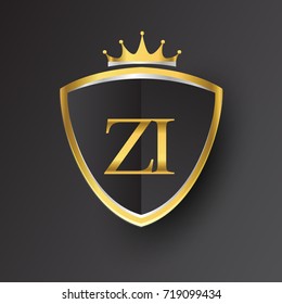 Initial logo letter ZI with shield and crown Icon golden color isolated on black background, logotype design for company identity.