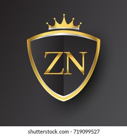 Initial logo letter ZN with shield and crown Icon golden color isolated on black background, logotype design for company identity.