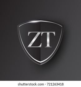 Initial logo letter ZT with shield Icon silver color isolated on black background, logotype design for company identity.