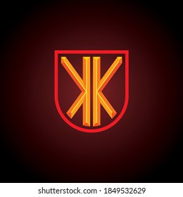 Logo inicial de la letra K reflejada en el escudo con efecto 3d grabado.