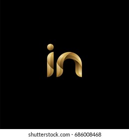 Initial lowercase letter in, curve rounded logo, gradient glossy gold color on black background