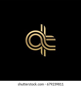 Initial lowercase letter qt, linked outline rounded logo, elegant golden color on black background