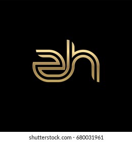 Initial lowercase letter zh, linked outline rounded logo, elegant golden color on black background
