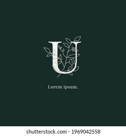 logotipo de monograma lujoso inicial de la letra U con vector de flores y hojas.