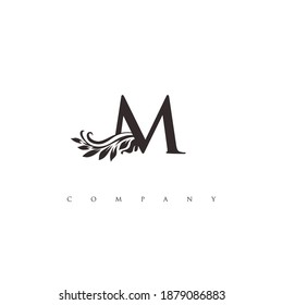 initial M logo with ornament symbol