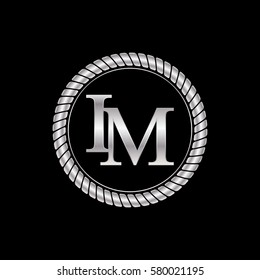 initial i and m logo silver metallic with metal circle rope frame border decorative