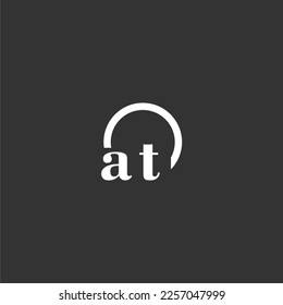 AT initial monogram logo with creative circle line design
