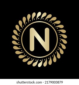  Initial N Golden leaf and circle logo design vector. Golden beauty N Logo and business symbol and alphabets vector design