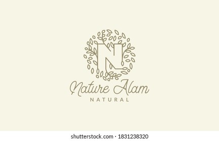 initial N or letter N with leaf  ornament on circle luxury modern logo vector icon illustration design 