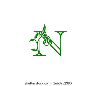 Initial N Logo. N Letter Design Vector with Green Color and Floral Hand Drawn Green Leaves.