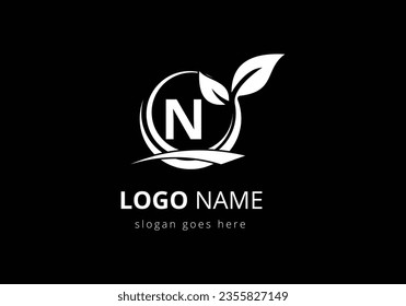 Initial N monogram alphabet with circle leaf and swoosh. Eco-friendly black logo concept