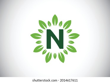Initial N monogram letter alphabet with leaf wreath. Green leaf, flower logo design concept. Modern vector logo design for business, and company identity