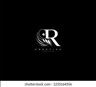Initial R letter luxury beauty flourishes ornament monogram logo