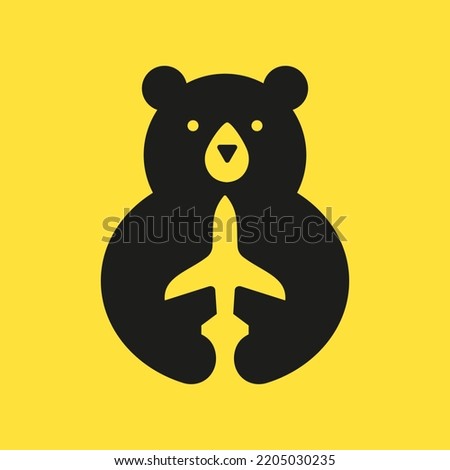 Initial Travel Bear Logo Negative Space Vector Template. Bear Holding Airplane Symbol