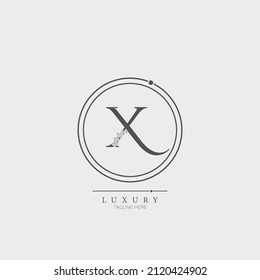 Initial X letter luxury beauty flourishes ornament monogram logo