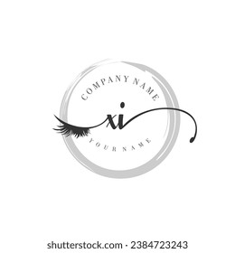 Initial XI monogram eye and eyelash handwriting