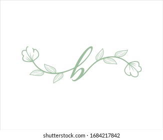 the initials B with light green flowers and leaf decorations