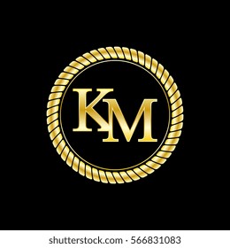 initials k and m logo luxurious golden letters with gold rope