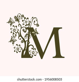 the initials M. monogram logo with flower and butterfly decoration. luxury beauty