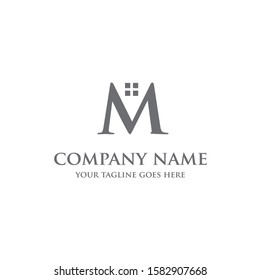 
the initials M for the real estate or housing logo