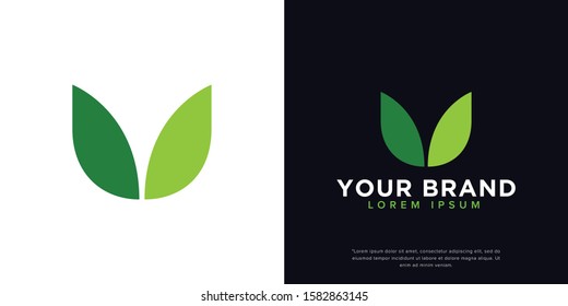 Initials U & green leaf logo design inspiration
