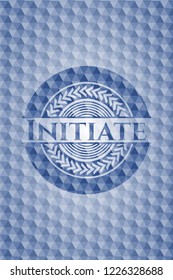 Initiate blue badge with geometric pattern background.