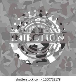 Injection on grey camouflaged texture