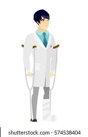 Injured asian doctor with broken leg on crutches. Doctor with broken leg in bandages. Full length of young doctor with broken leg. Vector flat design illustration isolated on white background.