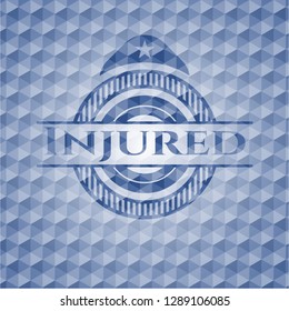 Injured blue emblem with geometric background.