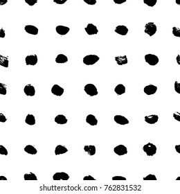 Ink abstract polka dot seamless pattern. Background with artistic strokes in black and white sketchy style. Design element for backdrops and textile.