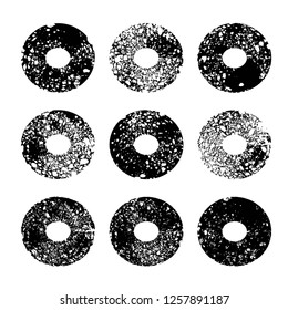 Ink black abstract textured circle imprint paint strokes isolated on white background