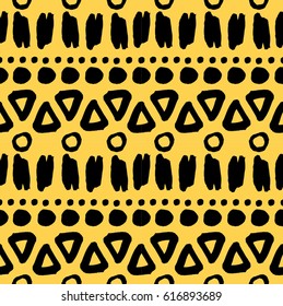ink brush elements geometric seamless pattern. yellow ethnic decorative ornament with black ink stains