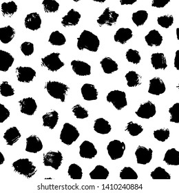 Ink brush spots hand drawn seamless pattern. Black blots, paint smears vector illustration. Monochrome speck texture. Round brushstroke stains backdrop. Wrapping paper, wallpaper, textile design