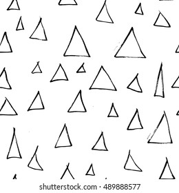 Ink hand drawn triangles. Seamless pattern.