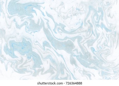 Ink marble abstract background in white, blue and black colors.