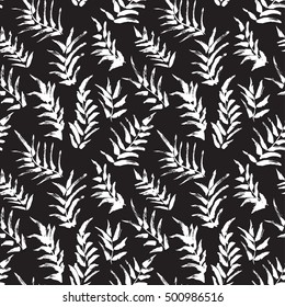 Ink seamless pattern with palm leaves in black and white colors. Artistic background with abstract plants. Design element for textile or wrapping paper 