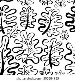 Ink seamless pattern with palm leaves in black and white colors. Artistic background with abstract plants. Design element for textile or wrapping paper 