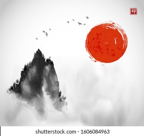 Ink wash painting with big red sun, flock of birds and high misty mountain peak on white background Traditional oriental ink painting sumi-e, u-sin, go-hua. Hieroglyph - zen.